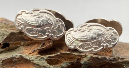 Mansjettknapper i 830 sølv med fugle motiv.